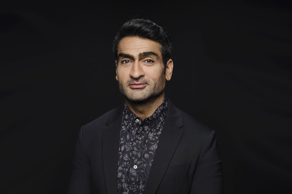 Kumail Nanjiani headshot in a suit.