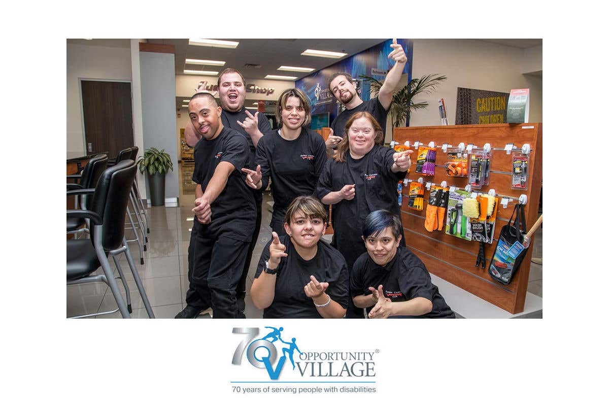 Members of Opportunity Village posing in front of the camera, with the Opportunity Village logo at the bottom.