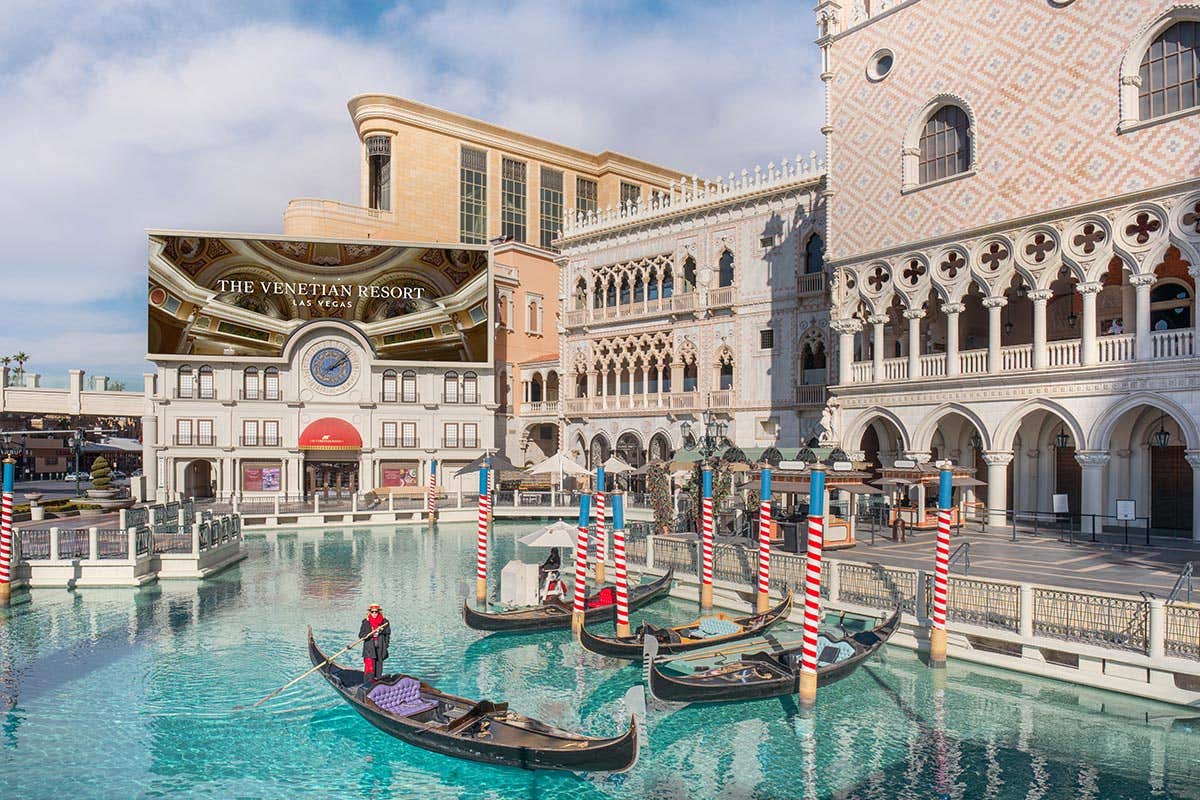 The Venetian Resort in Las Vegas with gondolas on a canal and Venetian-style architecture in the background.