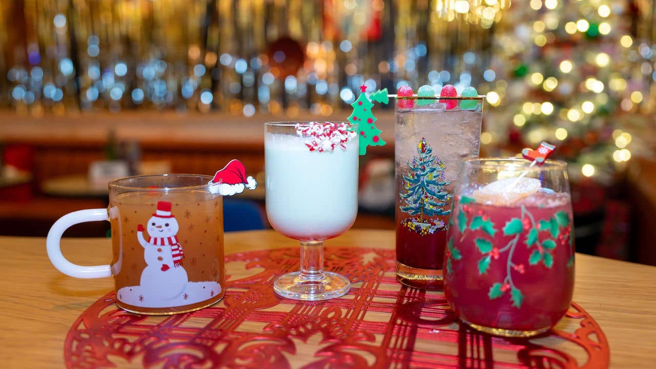 Festive Christmas Cocktails line up on a table. 