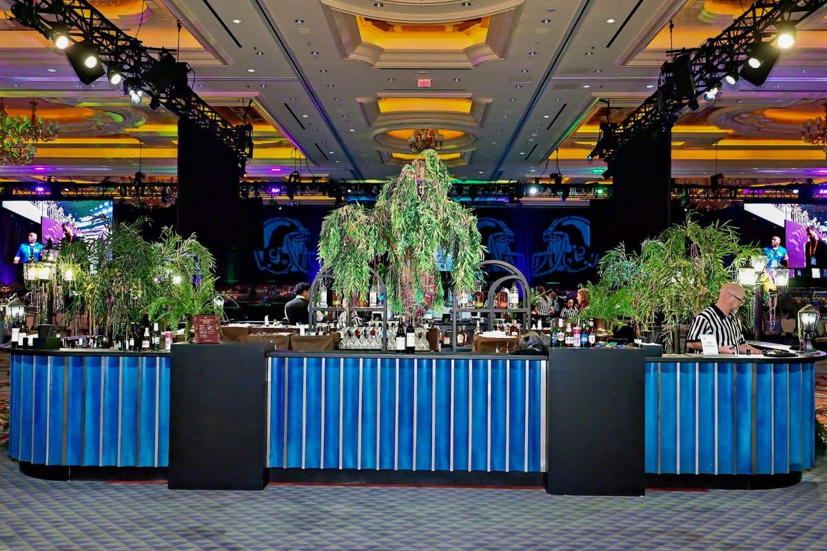 Casino event bar setup with décor, lighting, and entertainment stage