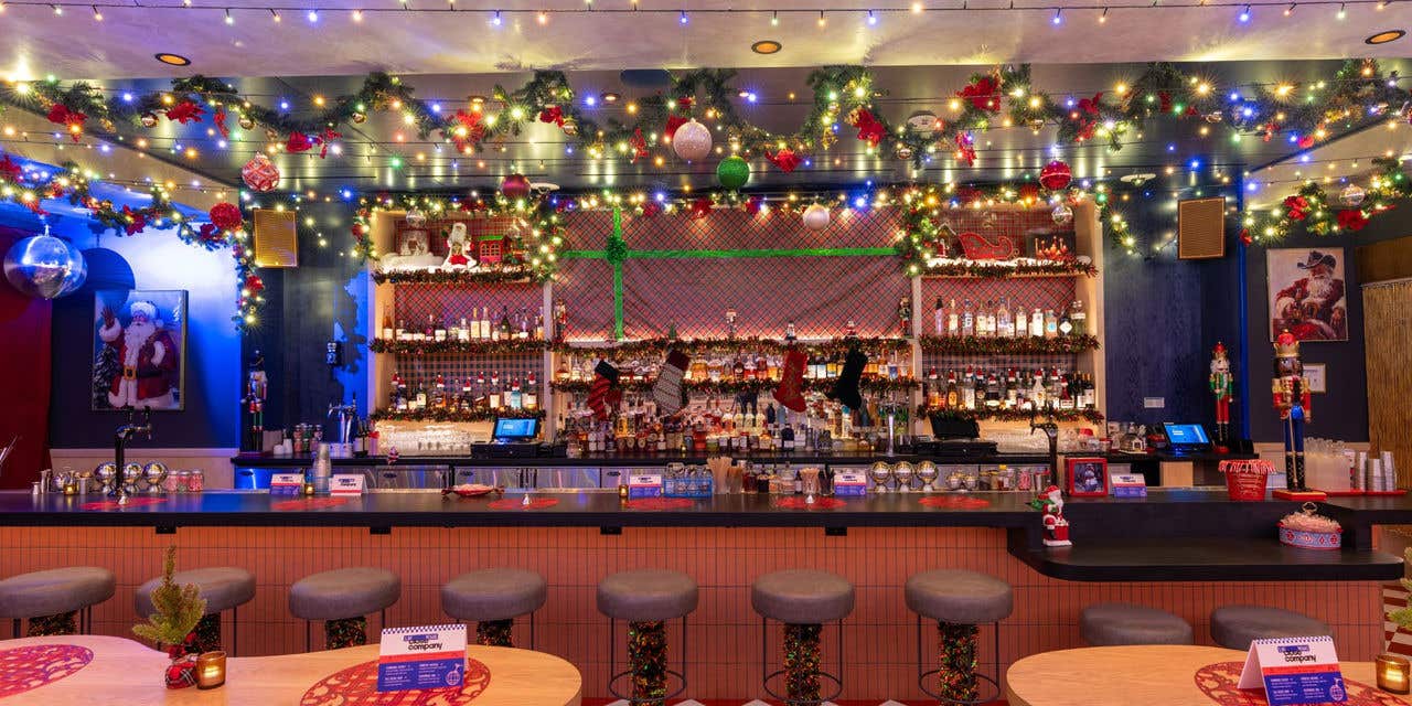 A bar extremely decorated with Christmas decor. 