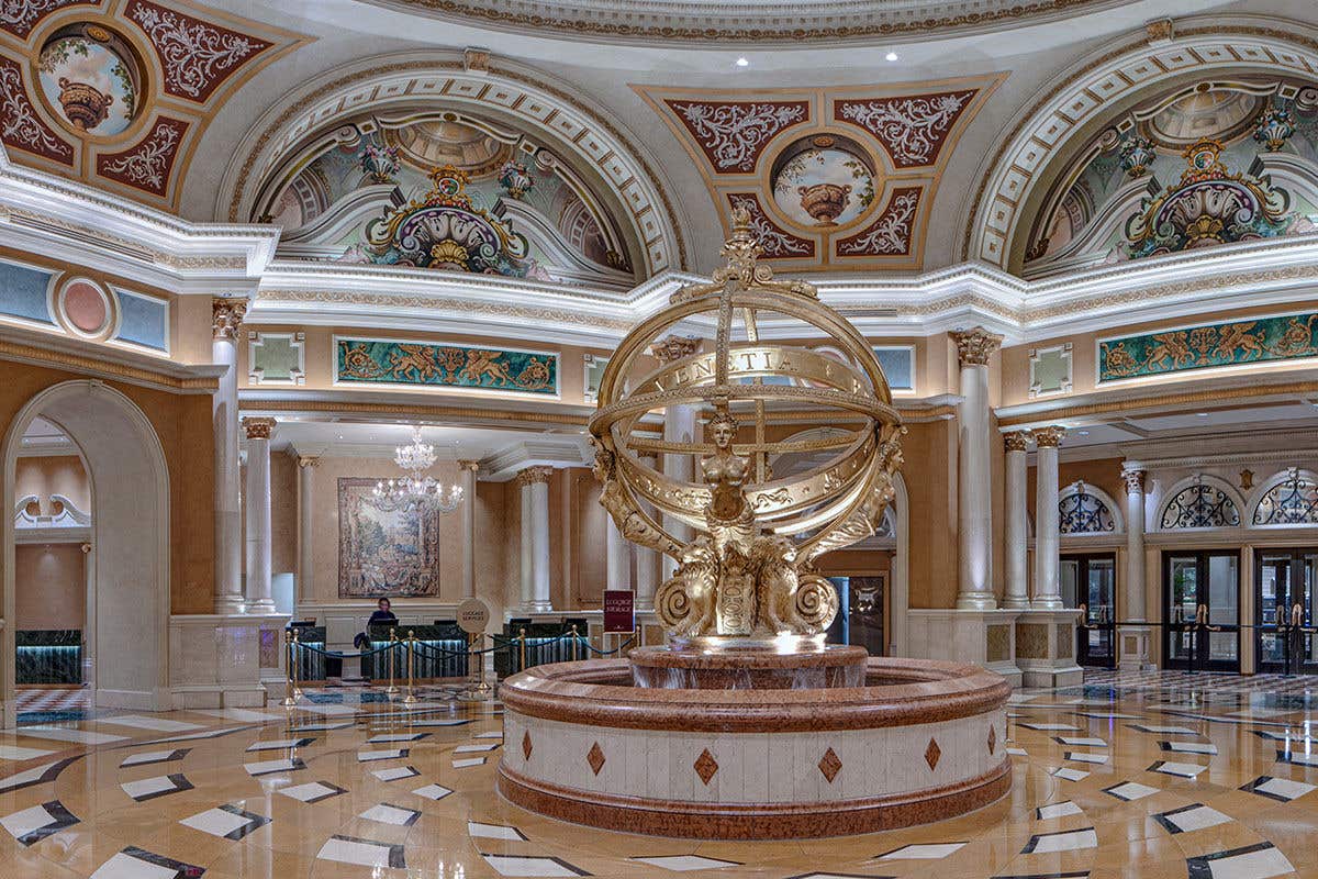A gold-like spherical structure called The Armillary Sphere in the lobby of The Venetian Lobby