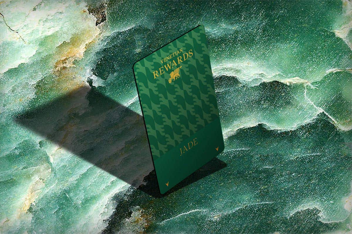 Venetian Rewards Jade tier card on a green marble background.
