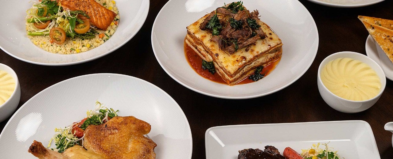 A table with several plates of food on it