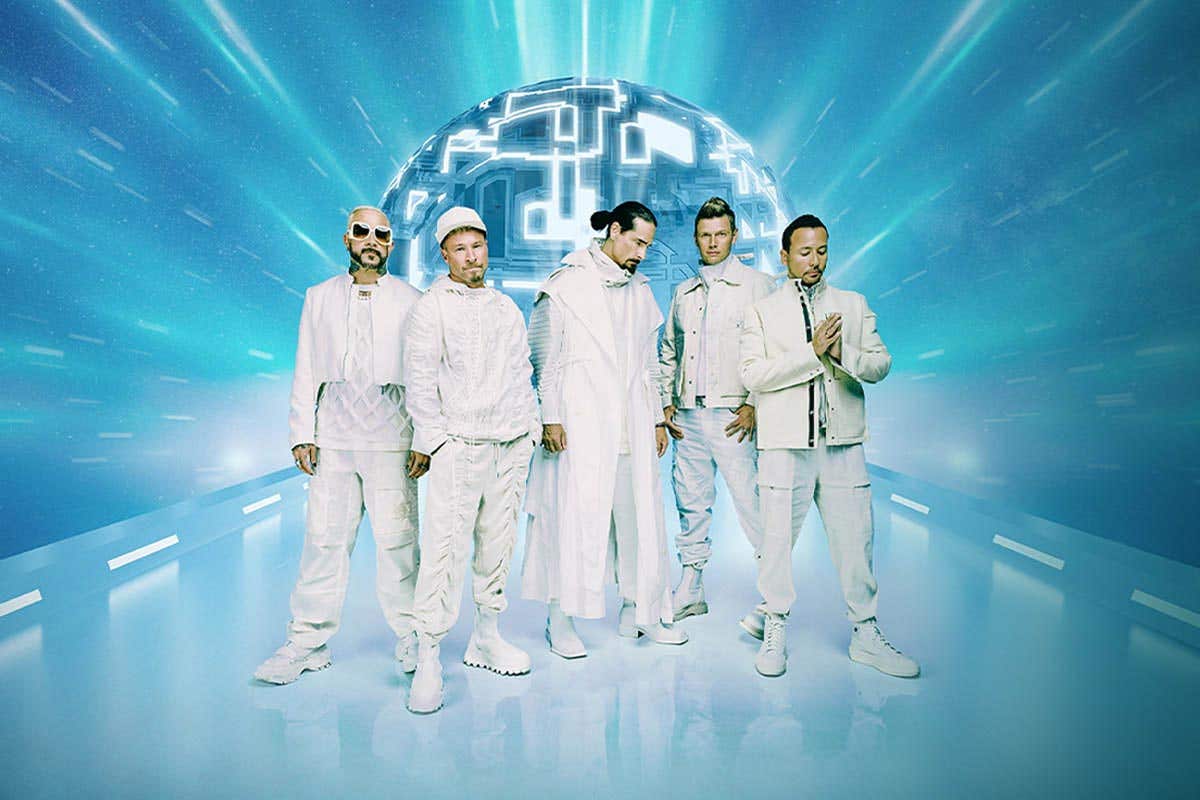 Backstreet Boys Millenium album art showing all 5 band members, dressed in white on blue background.