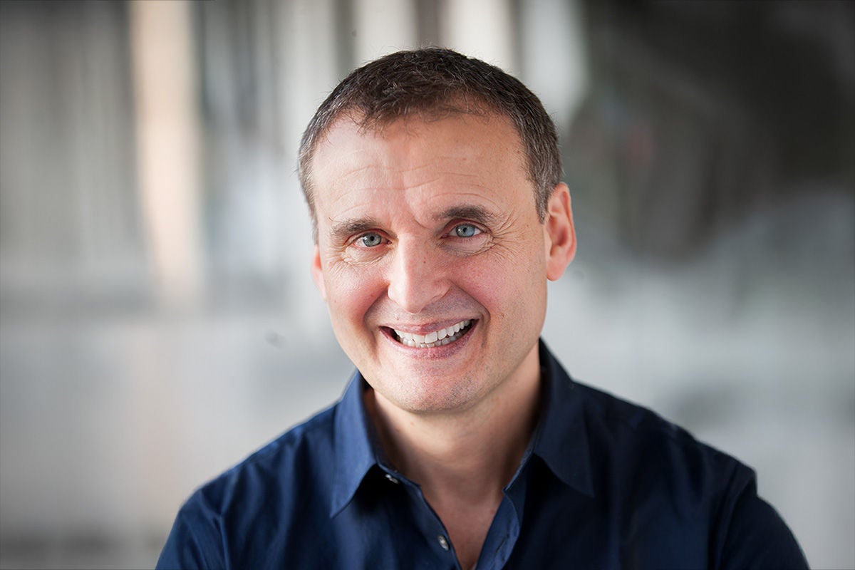 Phil Rosenthal headshot seated in a blue shirt.