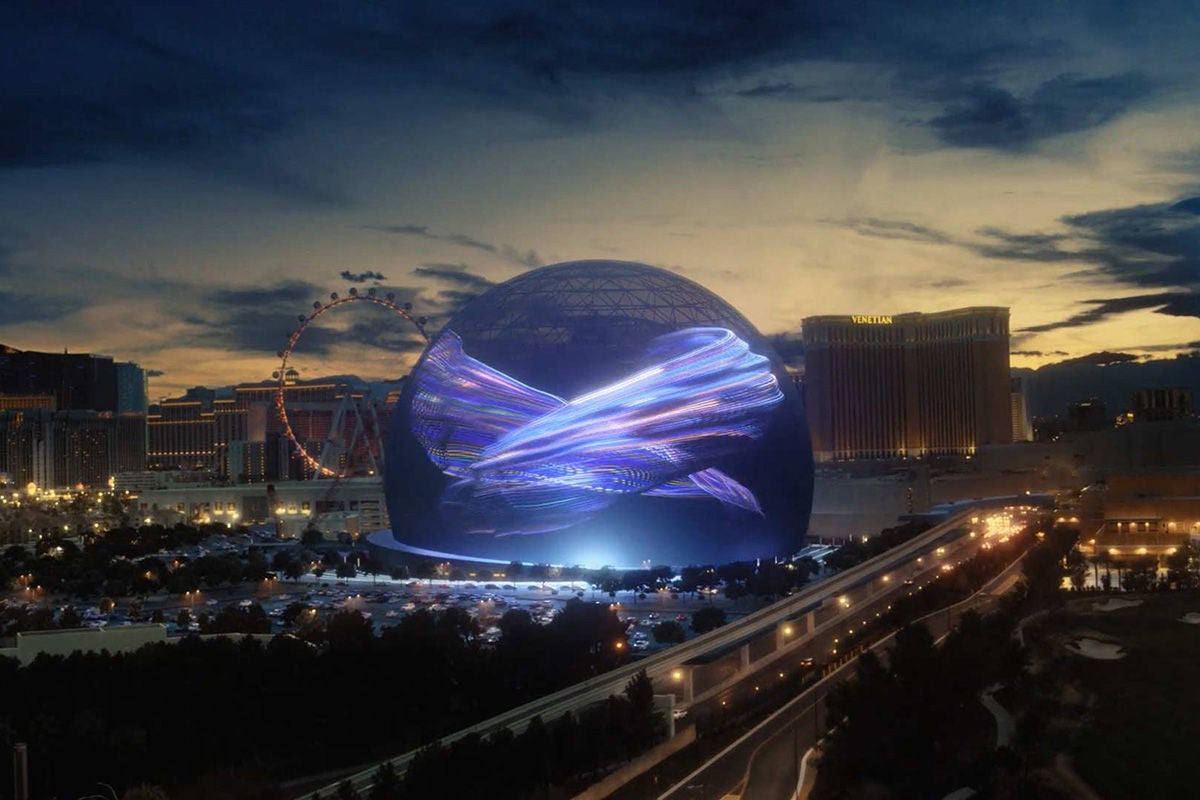 Exterior of The Sphere with a ferris wheel in the background.