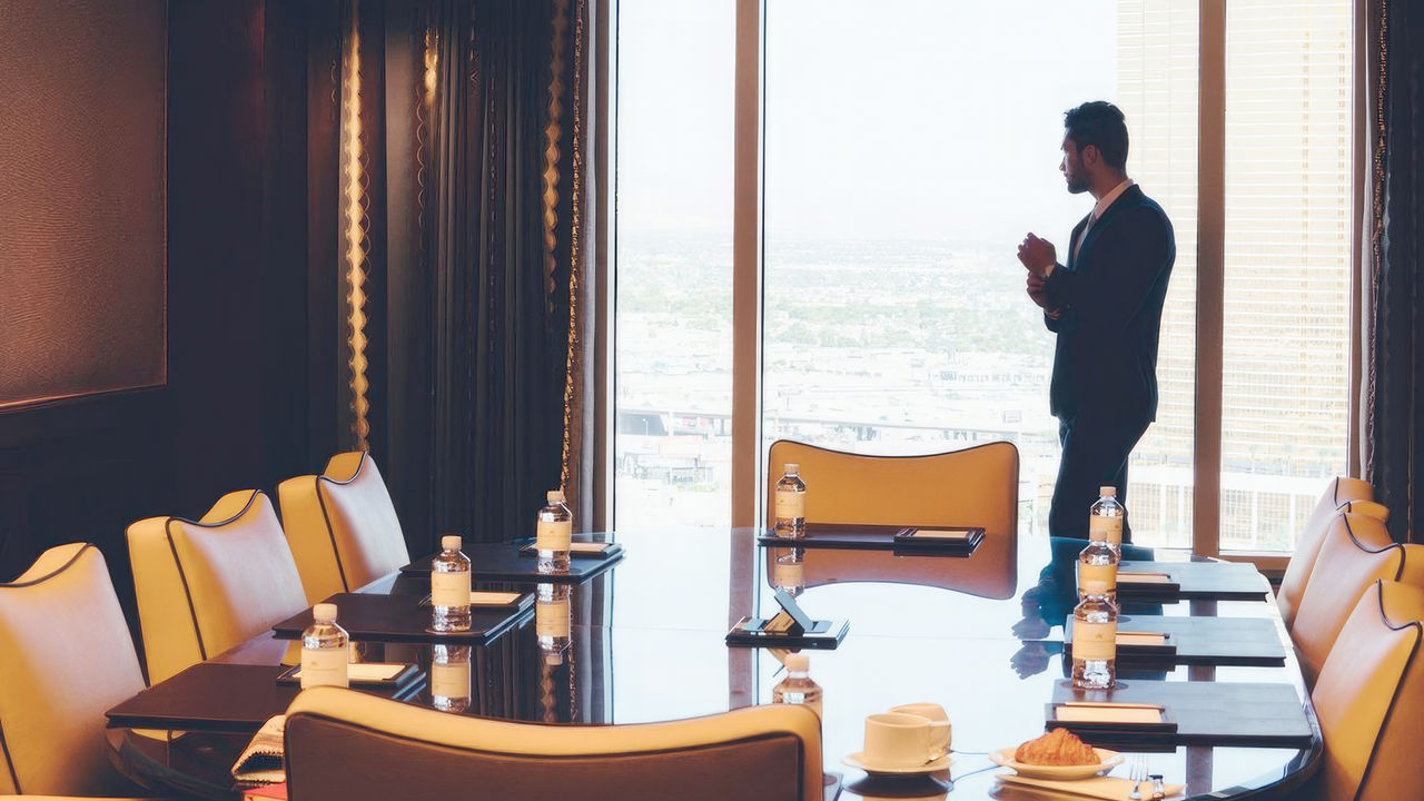 Man looking out a window from a Venetian Las Vegas meeting room
